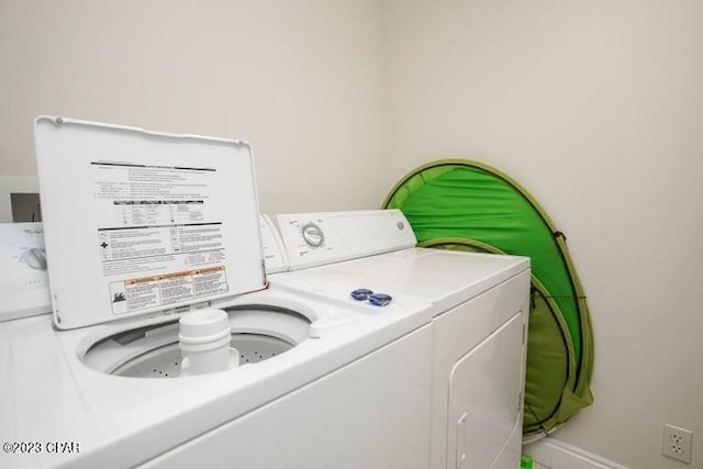 laundry room featuring washing machine and dryer