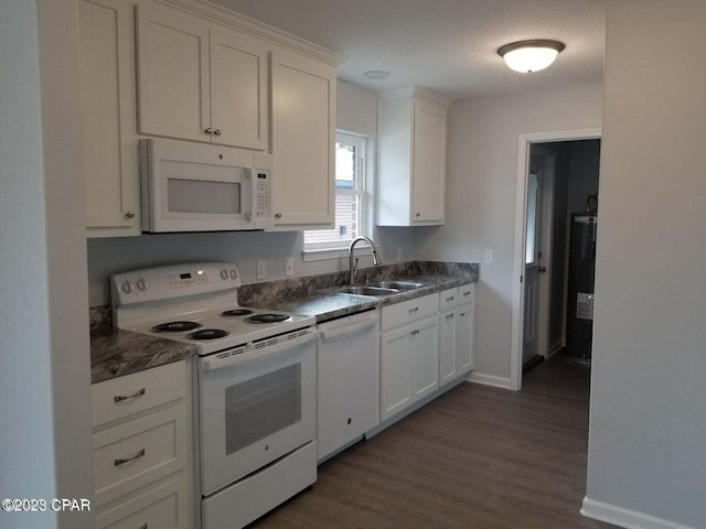 kitchen featuring dark hardwood / wood-style floors, white appliances, white cabinets, and sink