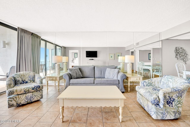 tiled living room with a textured ceiling