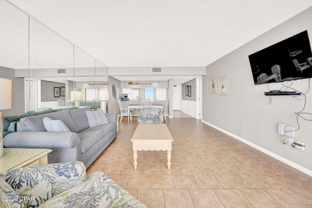 tiled living room with a textured ceiling