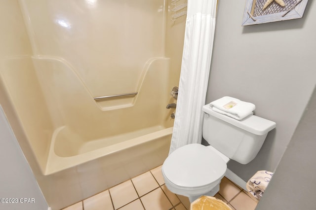 bathroom featuring shower / tub combo, tile floors, and toilet