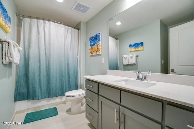 bathroom with toilet and vanity