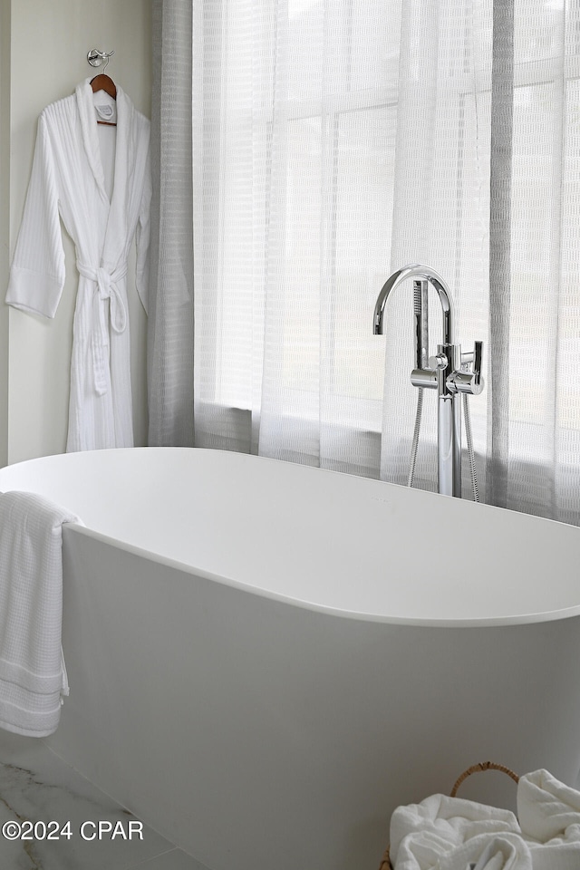 bathroom with tile flooring