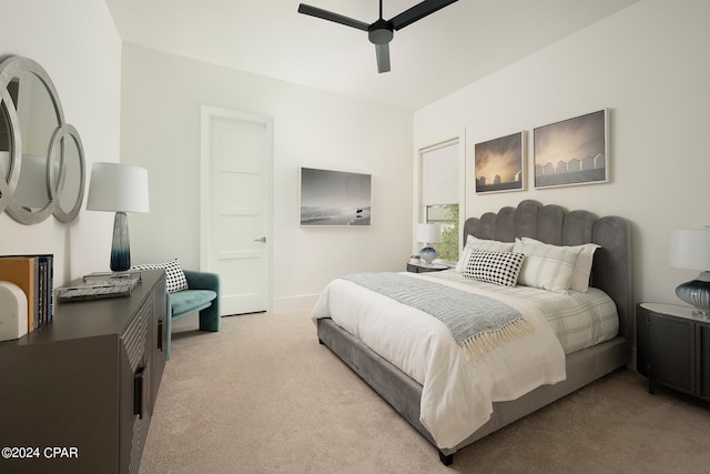 bedroom featuring light carpet and ceiling fan