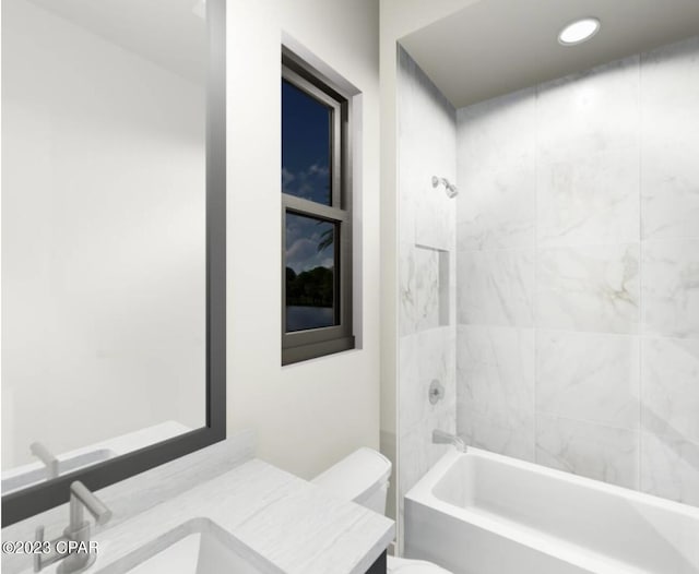 full bathroom featuring toilet, tiled shower / bath combo, and vanity