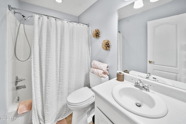 full bathroom featuring toilet, vanity, and shower / bath combo with shower curtain