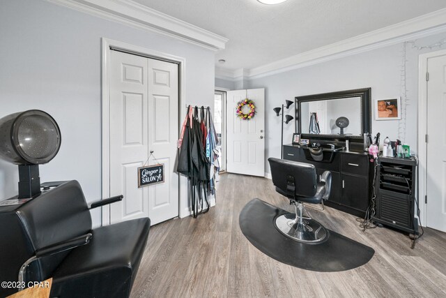 interior space with hardwood / wood-style floors and crown molding