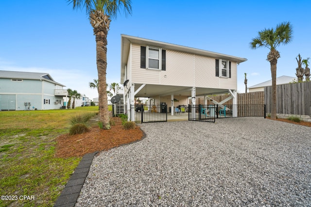 rear view of property with a yard