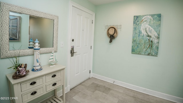 doorway with light tile floors