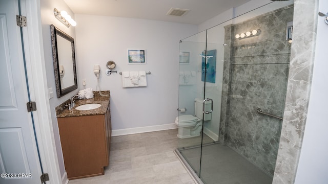 bathroom with walk in shower, toilet, vanity, and tile flooring