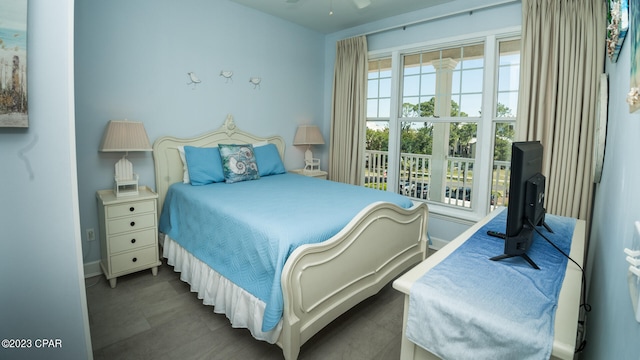 bedroom with dark tile flooring