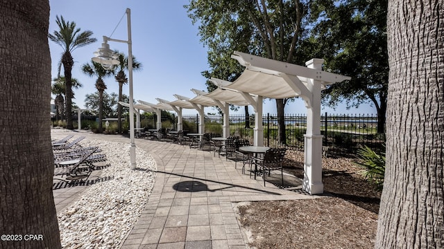 view of terrace featuring a pergola