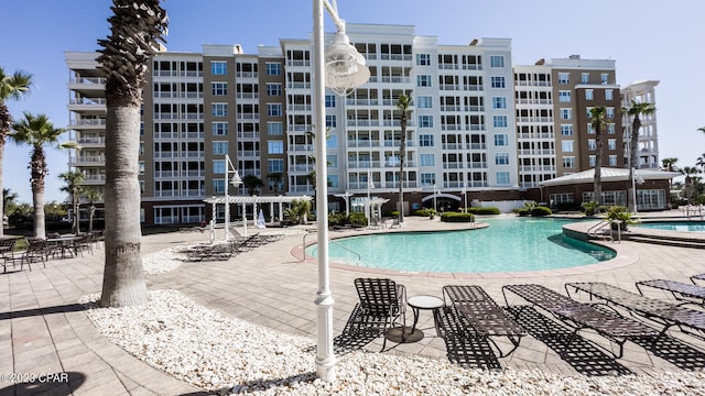 view of swimming pool featuring a patio