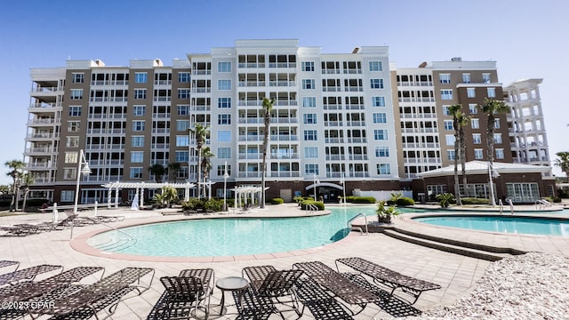 view of swimming pool featuring a patio area