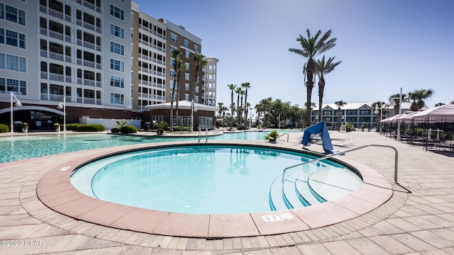 view of swimming pool with a patio