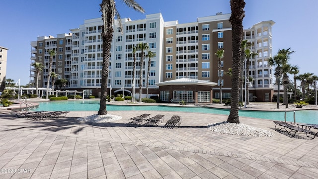 view of swimming pool featuring a patio area