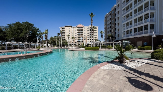 view of pool with a jacuzzi