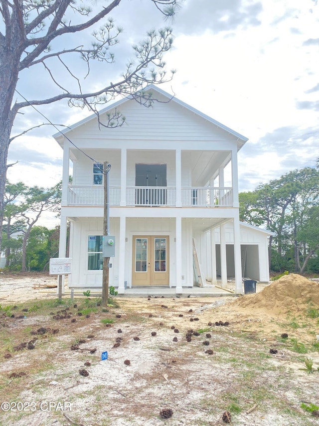 back of property featuring a balcony