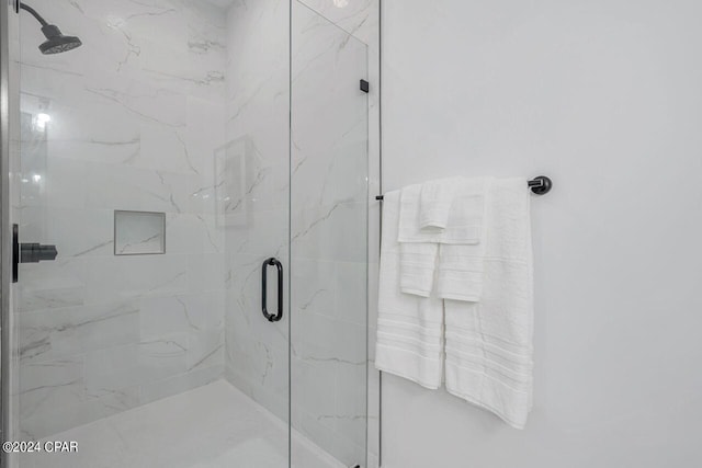 bathroom featuring an enclosed shower