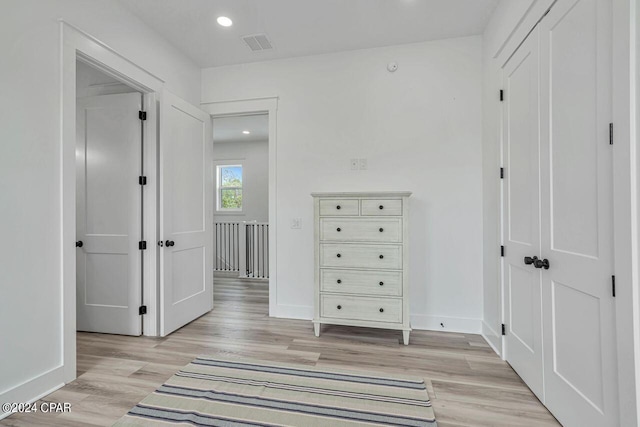 corridor featuring light hardwood / wood-style floors