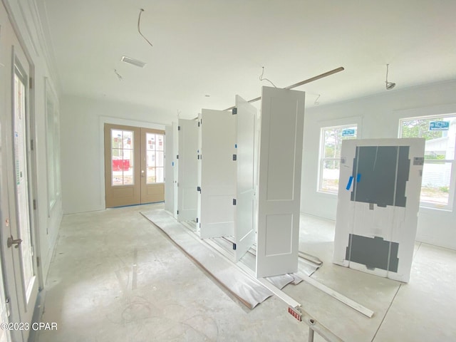 interior space featuring french doors and a healthy amount of sunlight