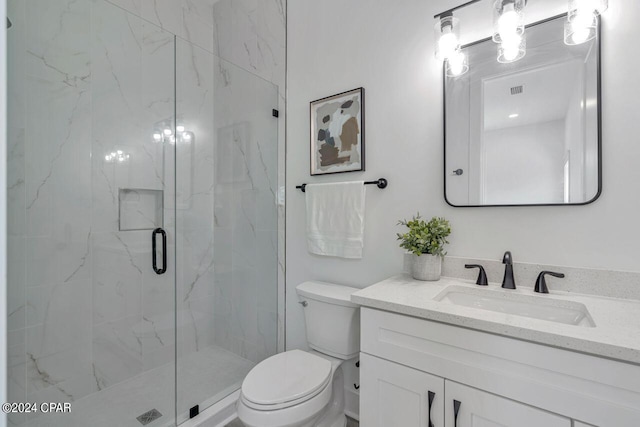 bathroom with walk in shower, vanity, and toilet