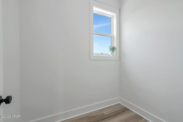 empty room with hardwood / wood-style flooring