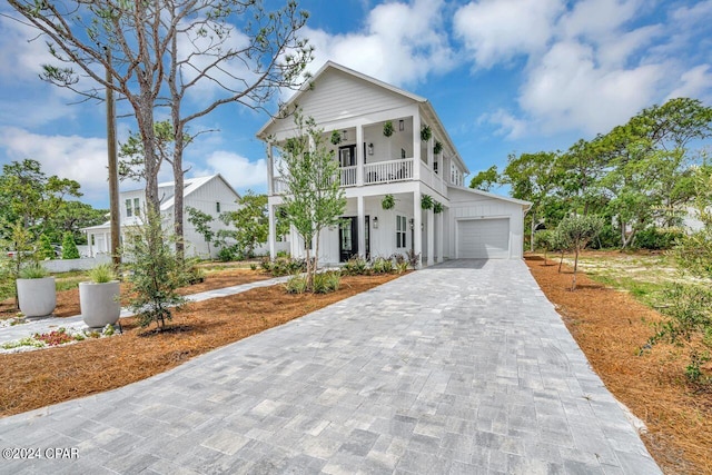 view of front of house featuring a garage and a porch