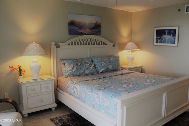 bedroom with light tile flooring