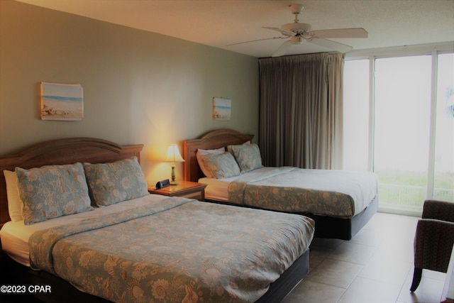 tiled bedroom with ceiling fan