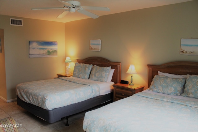 bedroom featuring ceiling fan and light tile floors