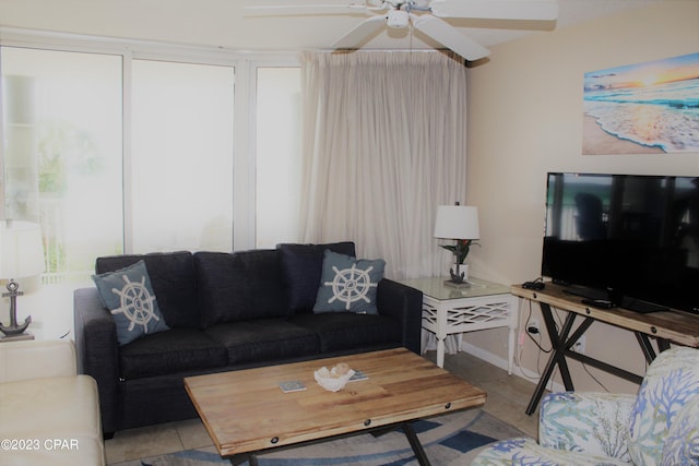 tiled living room with ceiling fan