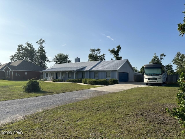 ranch-style home with a front lawn and a garage