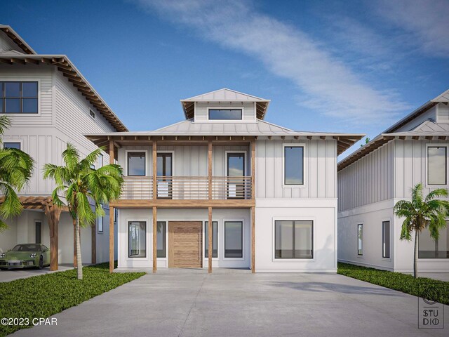 view of front of home featuring a balcony