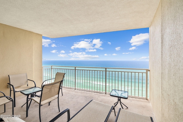 balcony featuring a water view