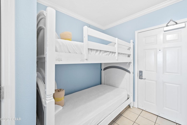 bedroom featuring ornamental molding and tile patterned flooring