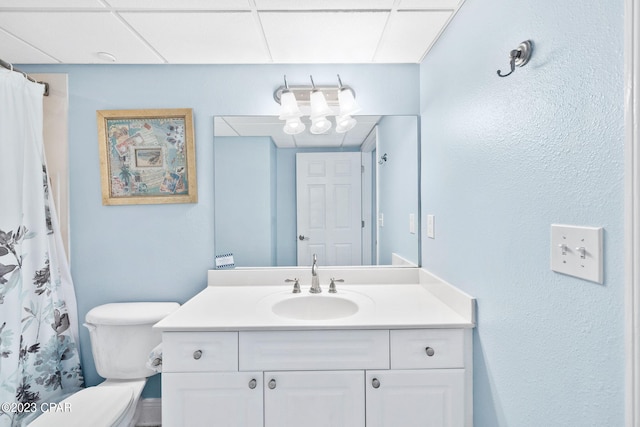 bathroom featuring toilet and vanity