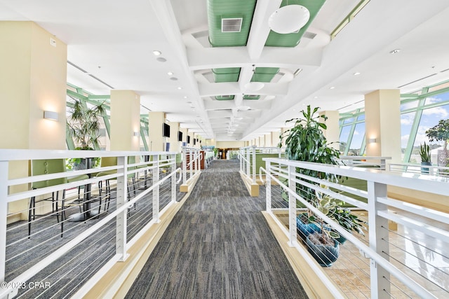 hall featuring visible vents, recessed lighting, coffered ceiling, and beamed ceiling