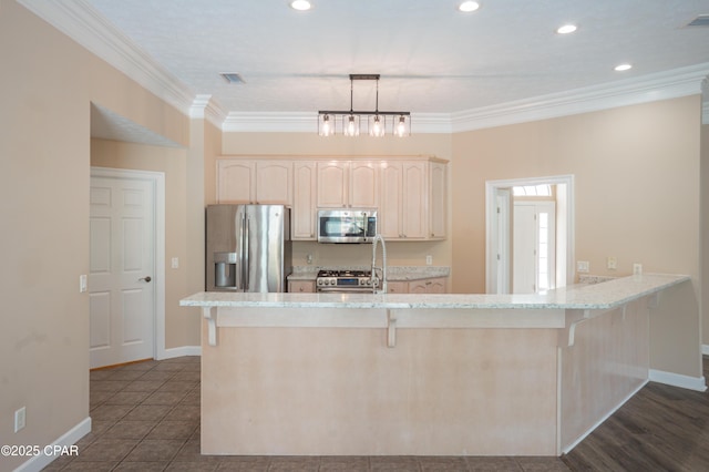 3522 Fox Run Blvd, Panama City, FL 32408 - kitchen with a kitchen breakfast bar, ornamental molding, light brown cabinets, and stainless steel appliances