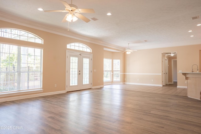 3522 Fox Run Blvd, Panama City, FL 32408 - unfurnished living room with recessed lighting, wood finished floors, visible vents, a ceiling fan, and ornamental molding