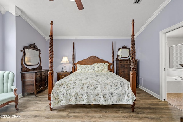 bedroom with wood finished floors, a ceiling fan, baseboards, and ornamental molding