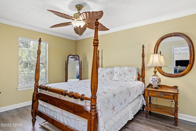 bedroom with baseboards, wood finished floors, and ornamental molding