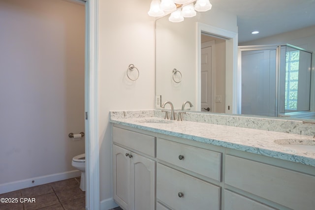 3522 Fox Run Blvd, Panama City, FL 32408 - bathroom with tile patterned flooring, double vanity, toilet, and a sink