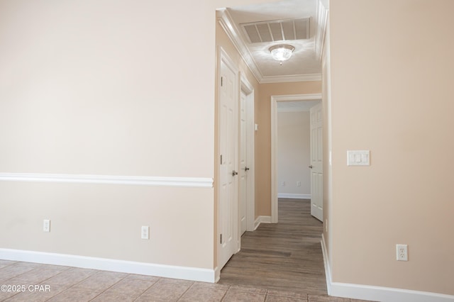 3522 Fox Run Blvd, Panama City, FL 32408 - hall featuring attic access, baseboards, ornamental molding, and visible vents
