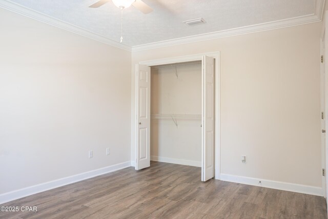 3522 Fox Run Blvd, Panama City, FL 32408 - unfurnished bedroom featuring visible vents, baseboards, wood finished floors, a closet, and ornamental molding