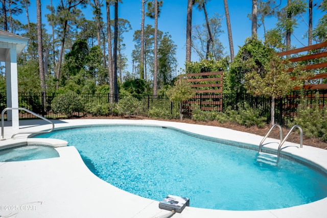 3522 Fox Run Blvd, Panama City, FL 32408 - view of swimming pool with a pool with connected hot tub, a patio, and fence