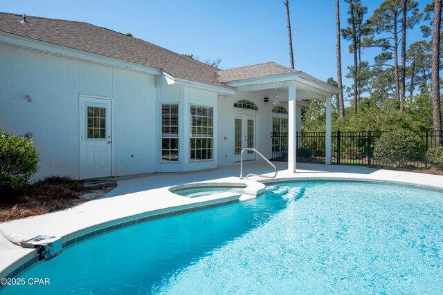 3522 Fox Run Blvd, Panama City, FL 32408 - view of swimming pool with french doors, a patio area, a pool with connected hot tub, and fence