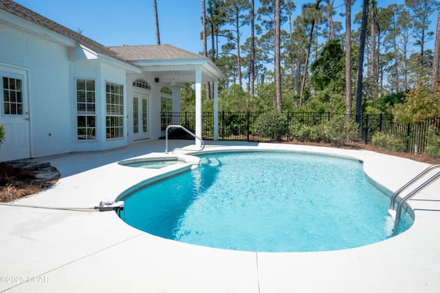 3522 Fox Run Blvd, Panama City, FL 32408 - view of swimming pool with french doors, a fenced backyard, a patio, a fenced in pool, and an in ground hot tub