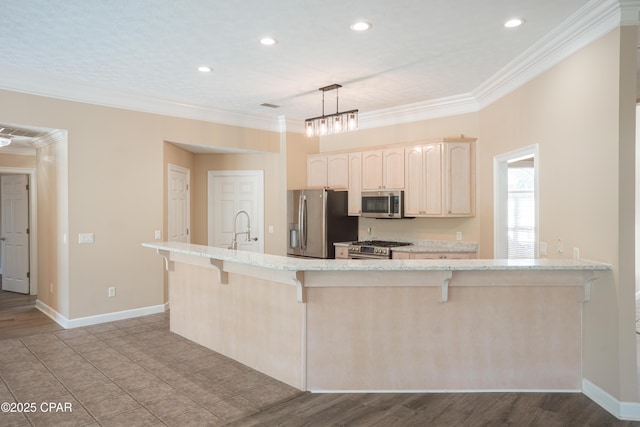 3522 Fox Run Blvd, Panama City, FL 32408 - kitchen with stainless steel appliances, a sink, crown molding, light brown cabinets, and a breakfast bar area