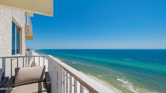 balcony featuring a water view